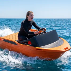 A beautiful woman sails smoothly on the sea aboard the PE02 electric boat