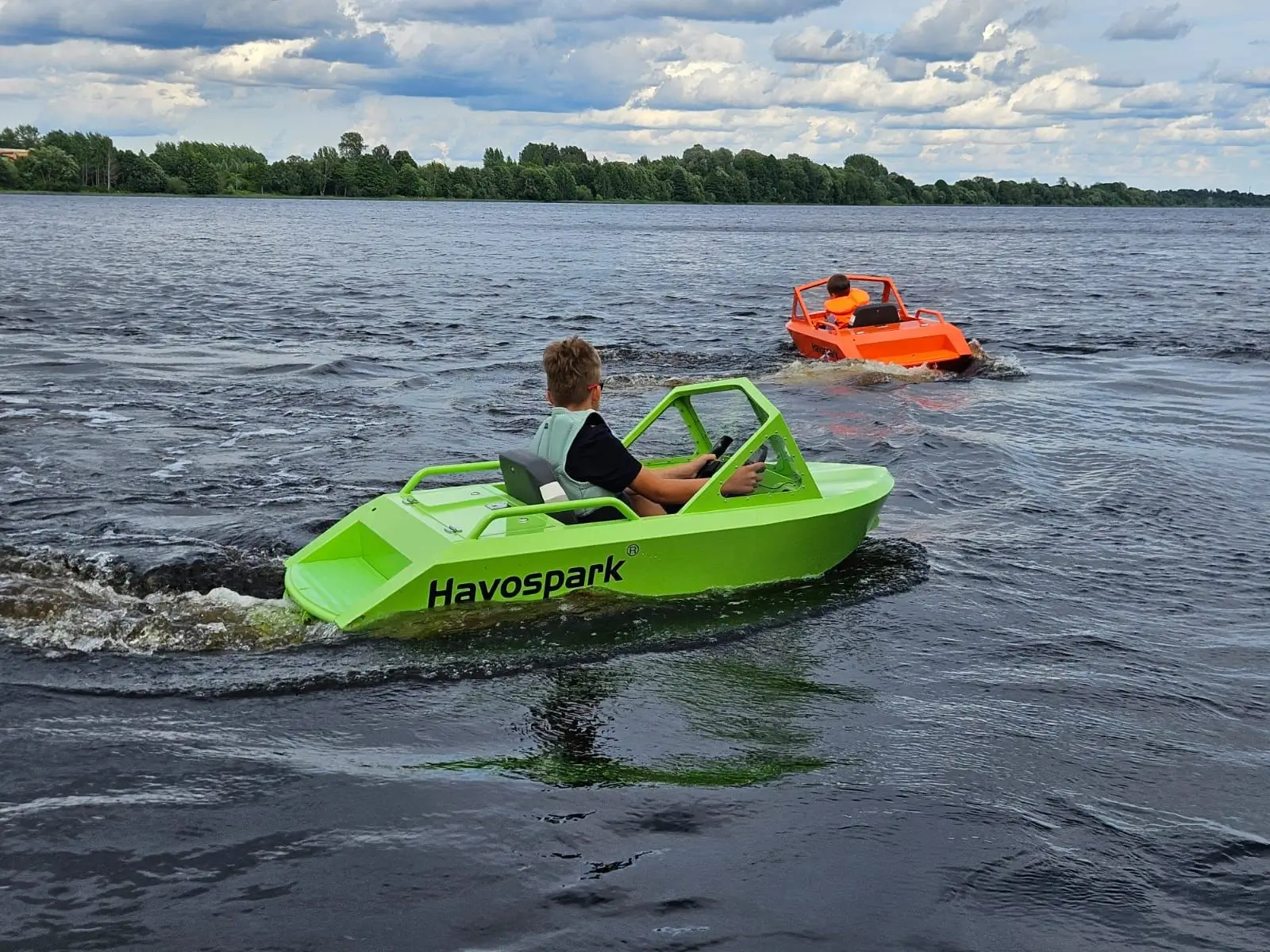 brothers have fun with mini jet boat